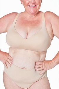 Body positivity psd beige lingerie happy plus size model posing