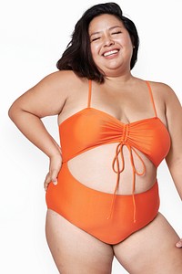 Body positivity orange swimsuit happy plus size model posing