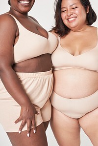 Attractive plus size model in beige women&#39;s lingerie