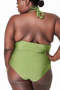 Women&#39;s green swimsuit psd model facing backward mockup