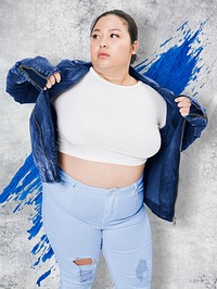 Plus size women&#39;s white tee jacket and jeans studio shot