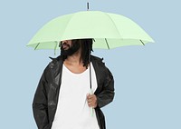 Man holding green umbrella psd studio shot