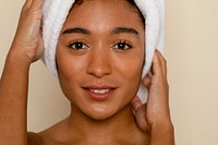 Woman with hair wrapped in towel