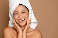 Woman with bath towel wrapped around hair