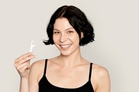 Woman holding dental floss toothpick, mouth hygiene