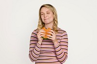 Happy woman eating a hamburger for lunch