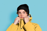 Young man in yellow winter jacket