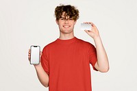 Young man holding phone and blank credit card