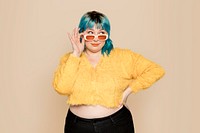 Cute woman in yellow cropped cardigan