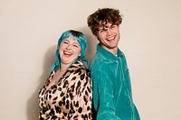 Cute hipster couple on beige background