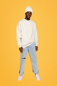 Young black man posing on yellow background