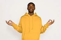 Black man meditating, isolated on white background