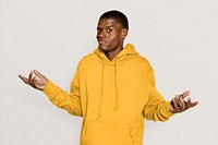 Shrugging African American man in yellow hoodie