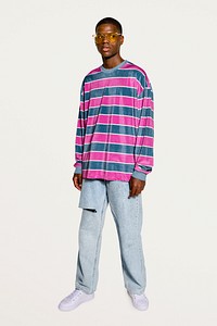 Stylish man posing in pink striped sweater 