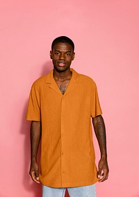 Man wearing orange short sleeve shirt