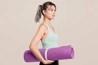 Active woman holding a yoga mat
