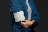 Blank volunteer armband on a denim jacket closeup
