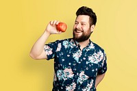 Man holding apple for healthy eating campaign