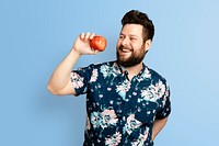 Man holding apple mockup psd for healthy eating campaign