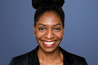 African-American woman smiling on blue background