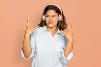 Joyful woman mockup psd listening to music through headphones digital device