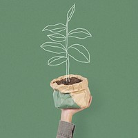 Hand mockup psd holding kraft paper plant pot environmentally friendly