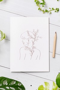 Feminine line art drawing on white paper 