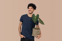 Happy man holding houseplant in sustainable packaging