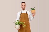 Small business owner holding potted plants