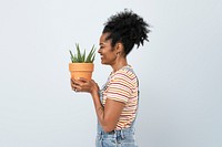 Happy plant parent mockup psd holding potted aloe vera side view
