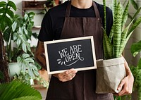 Blackboard sign mockup psd with plant shop owner