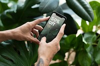 Phone screen mockup psd in with online houseplant shop ads