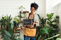 Blackboard sign mockup psd with plant shop owner