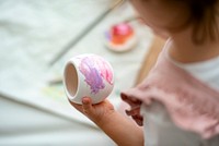 Kid painting plant pot DIY hobby