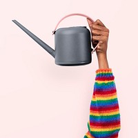 Hand mockup psd holding gray watering can gardening tool