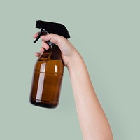 Hand mockup psd holding water spray bottle