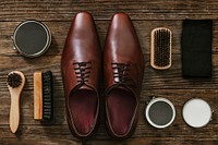 Men&rsquo;s leather shoes with polishing tools in vintage style