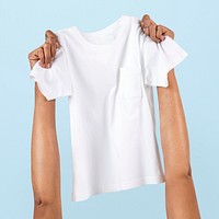 Hand holding t-shirt kids apparel