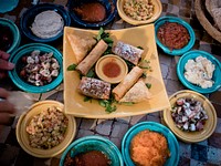 Arabic dumplings with dips and sauces. Original public domain image from Wikimedia Commons