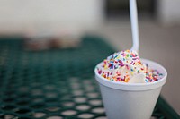 Ice cream in a foam cup with multi-colored sprinkles and a plastic spoon. Original public domain image from <a href="https://commons.wikimedia.org/wiki/File:Ice_cream_in_cup_with_sprinkles_and_spoon.jpg" target="_blank" rel="noopener noreferrer nofollow">Wikimedia Commons</a>