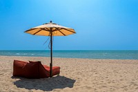 Bean bag on the beach, umbrella. Original public domain image from Wikimedia Commons