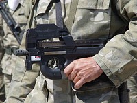 FN P90 submachine gun in hands of Cypriot National Guard during parade in Larnaca. Original public domain image from Wikimedia Commons