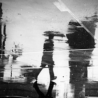 Man reflection on a wet street. Original public domain image from Wikimedia Commons