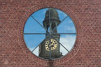Reflection of St. Michaelis Church in a window of St. Ansgar in Hamburg, Germany. Original public domain image from Wikimedia Commons