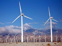 Wind turbines at a wind farm. Original public domain image from Wikimedia Commons