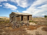 Old cabin and buckboard wheels in Big Horn County, Wyoming. Original image from Carol M. Highsmith&rsquo;s America, Library of Congress collection. Digitally enhanced by rawpixel.