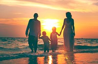 Family having fun on vacation with perfect sunset