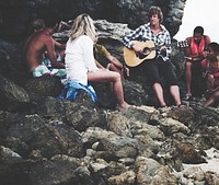 A group of diverse people is having fun at the beach