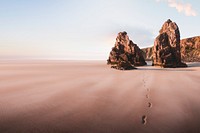 Beautiful beach scenery with footprints in the sand