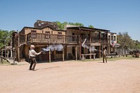 Two &quot;gunslingers&quot; (historical intrepreters Wes Hughes, left, and Thornton Young) fire away in a showdown on the street at the Enchanted Springs Ranch and Old West theme park, special-events venue, and frequent movie and television-commercial set in Boerne, Texas, northwest of San Antonio.